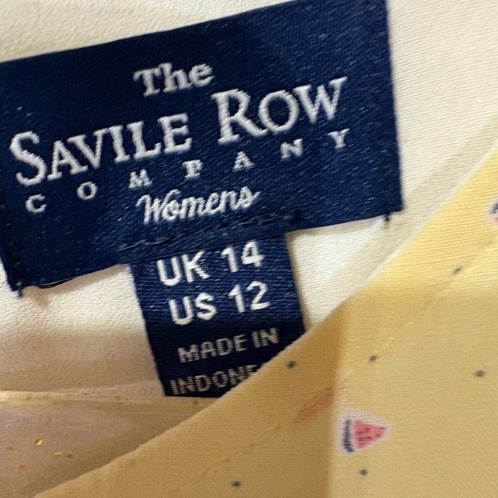 The Savile Row Dress This is a beautiful yellow dress with small print. - Picture 2 of 4